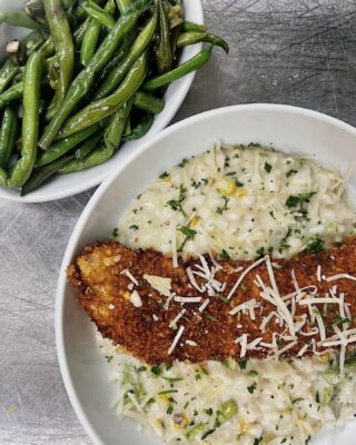 Breaded chicken over creamy risotto with green beans.