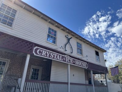 Crystal Ice House storefront with American flag.